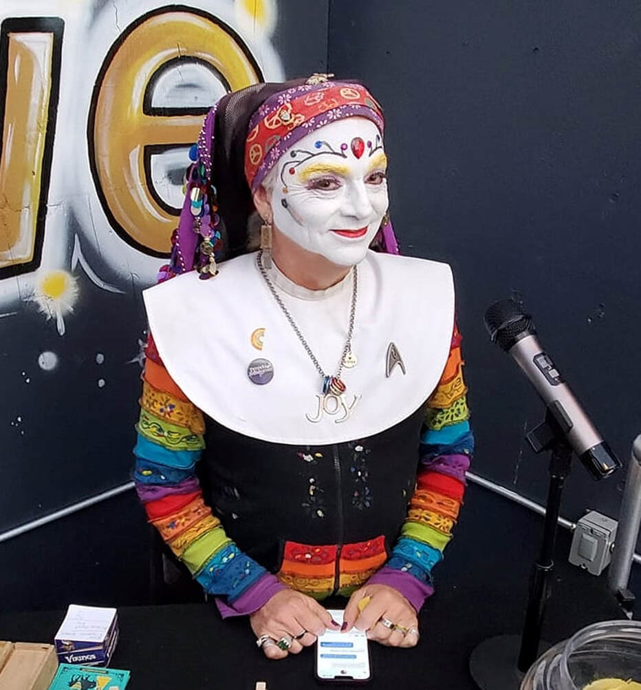 Color photo of San Diego Sister of Perpetual Indulgence Sister Ida Know hosting Pictionary Tuesdays at Number One Fifth Avenue in Hillcrest.