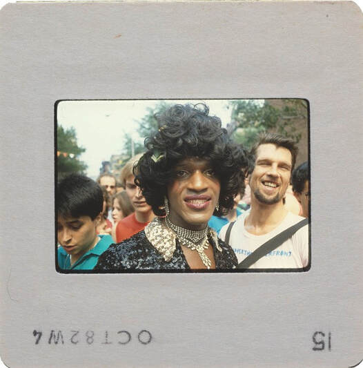 Photographic slide picturing Marsha P. Johnson at a New York Gay Pride March.