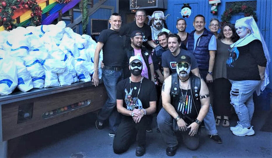 Members of the community and The San Diego Sisters of Perpetual Indulgence gather at #1 Fifth Avenue before distributing toiletries to the homeless population.